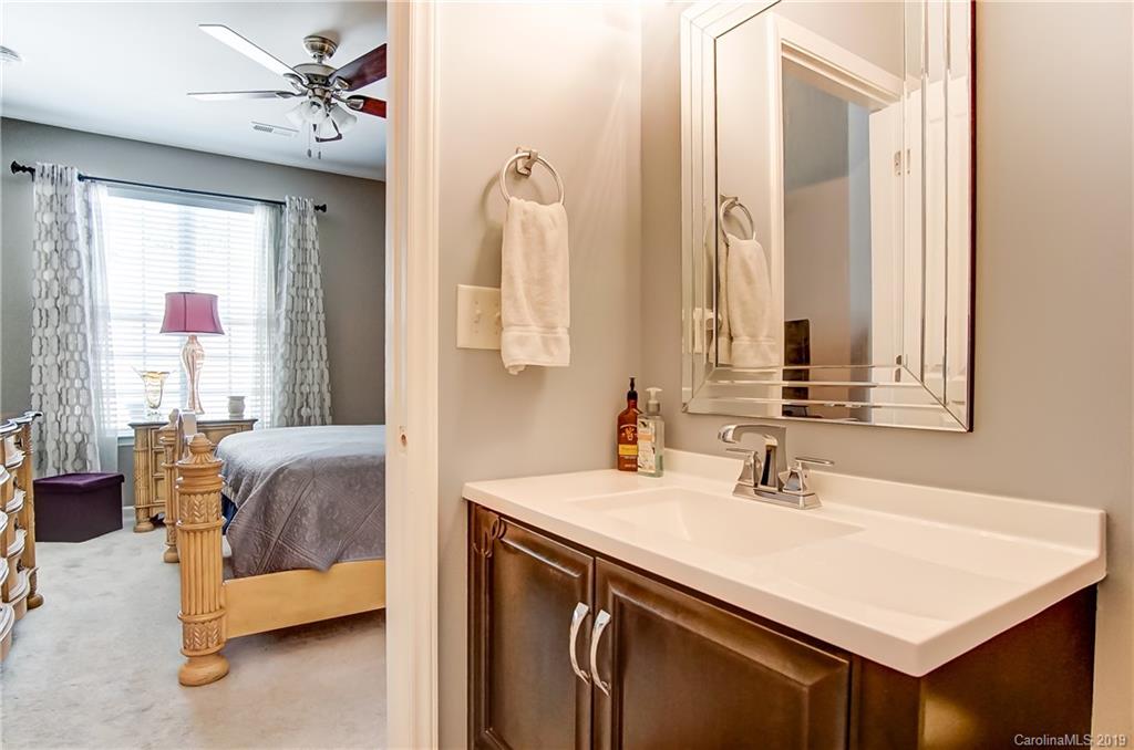 818 Gentlewinds Court Fort Mill, SC 29708 - Photo 16 of 22 a en suite bathroom with a sink double vanity and a mirror