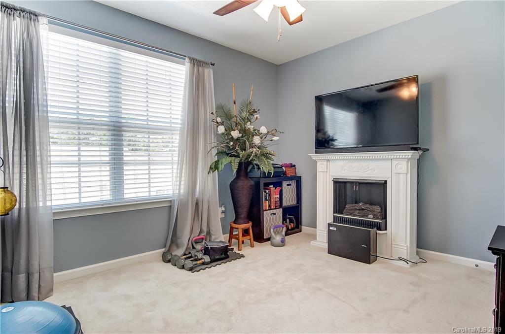 818 Gentlewinds Court Fort Mill, SC 29708 - Photo 18 of 22 a living room with furniture and a flat screen tv