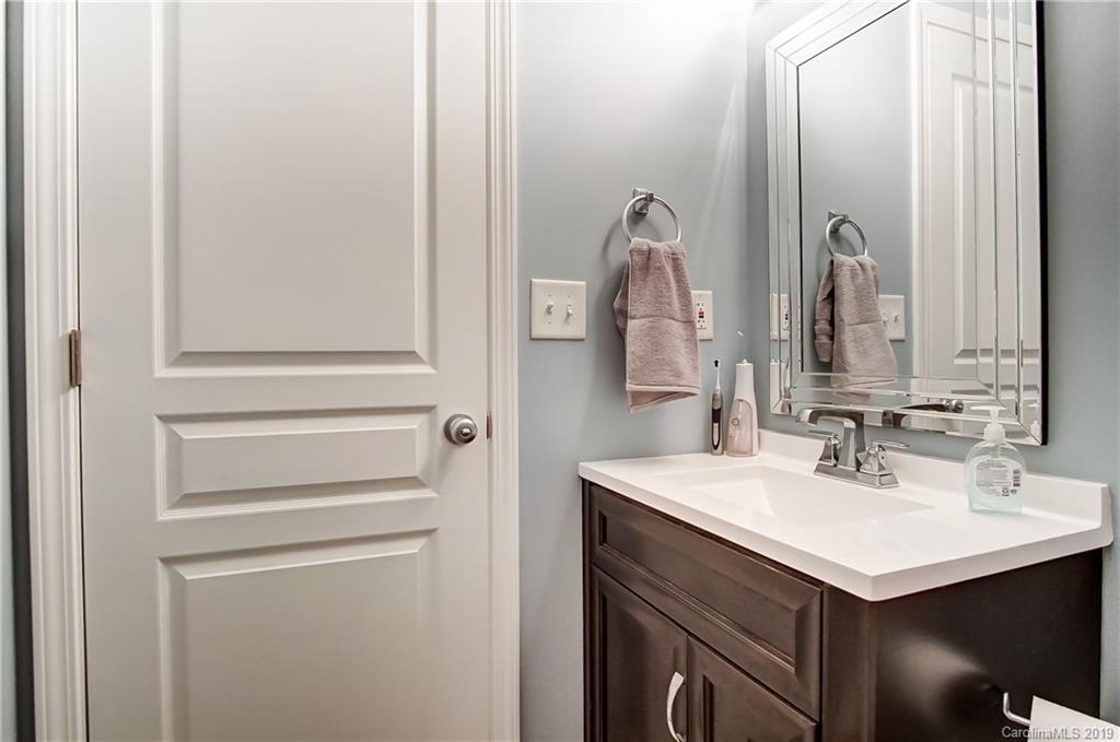 818 Gentlewinds Court Fort Mill, SC 29708 - Photo 19 of 22 a bathroom with a sink and a mirror