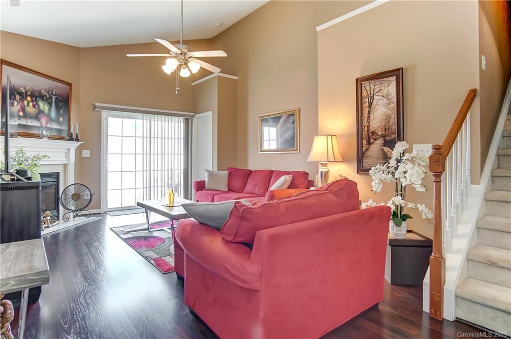 818 Gentlewinds Court Fort Mill, SC 29708 - Photo 3 of 22 a living room with furniture and a chandelier