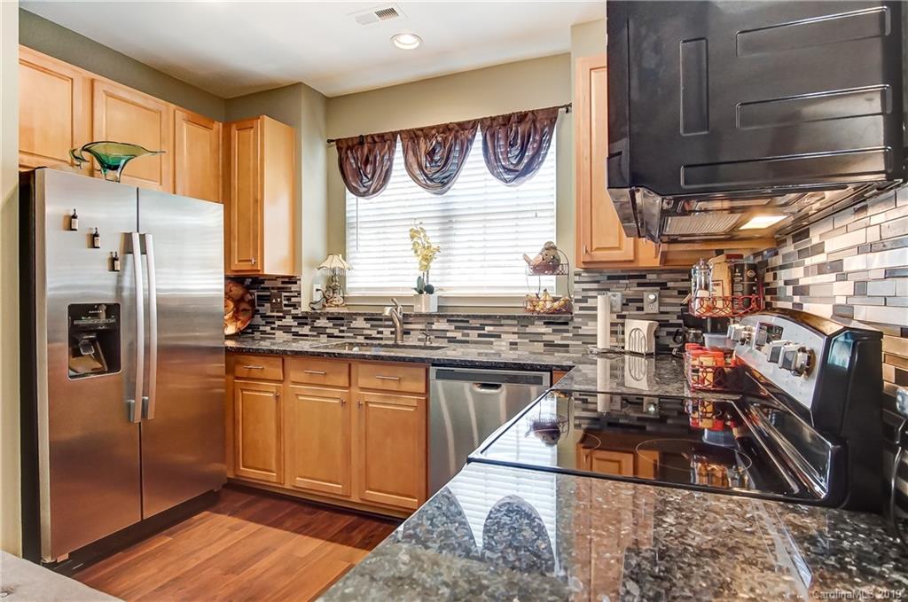 818 Gentlewinds Court Fort Mill, SC 29708 - Photo 8 of 22 a kitchen with stainless steel appliances granite countertop a refrigerator and a sink