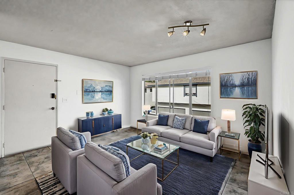 3448 Seabreeze Walk Oceanside, CA 92056 - Photo 4 of 29 a living room with furniture and wooden floor