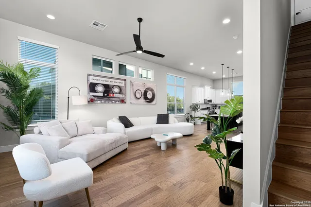a kitchen with a sink a stove and chairs