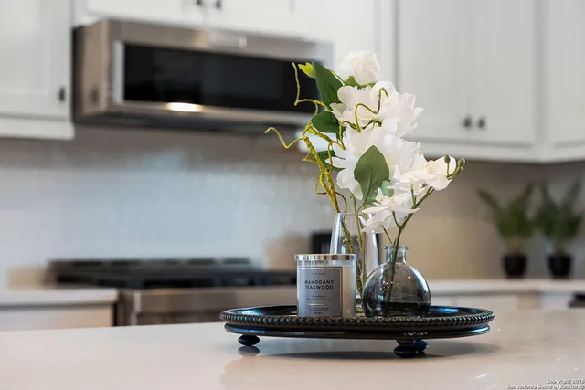 a picture of a table and a vase of flowers sitting on a table