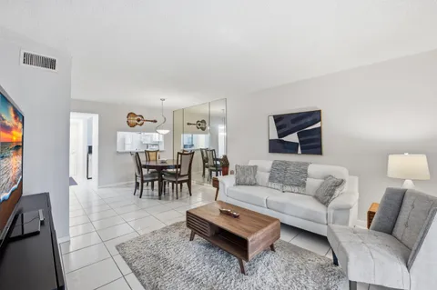a living room with furniture and a table