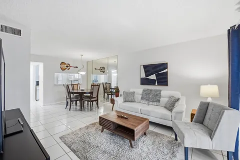a bedroom with bed and a chandelier