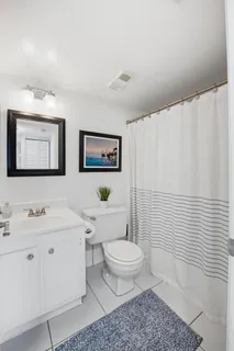 a view of a dining room with furniture and a window