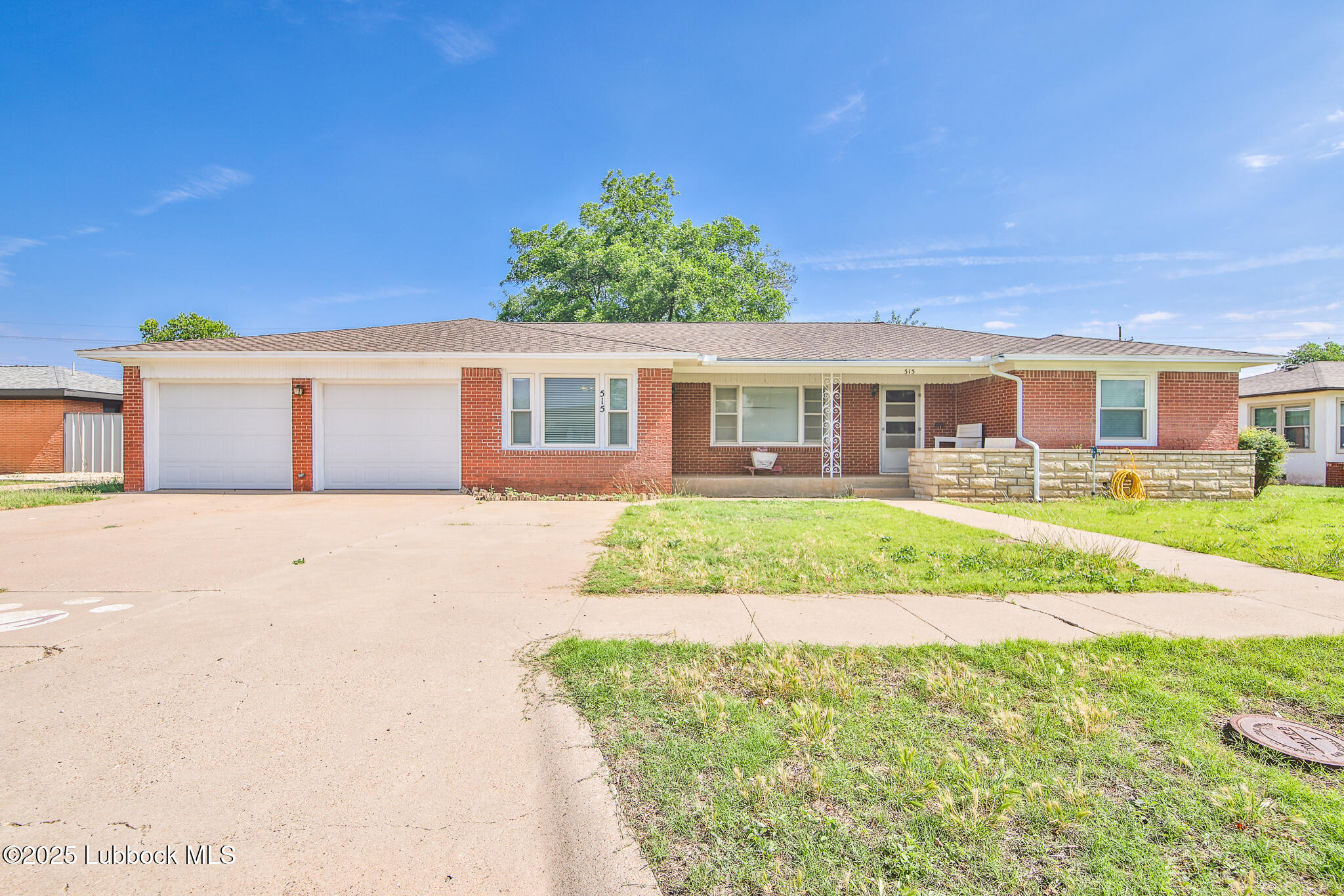 515 East 16th Street Littlefield, TX 79339 - Photo 1 of 32 a front view of a house with a yard