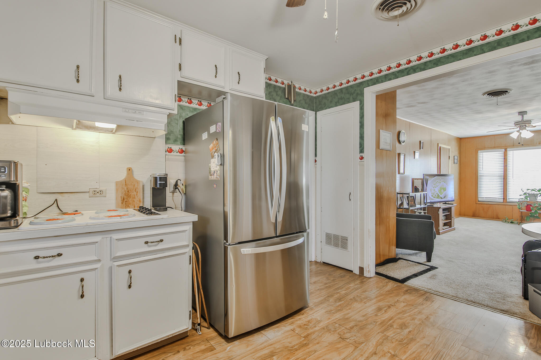 515 East 16th Street Littlefield, TX 79339 - Photo 11 of 32 a kitchen with a refrigerator and countertop