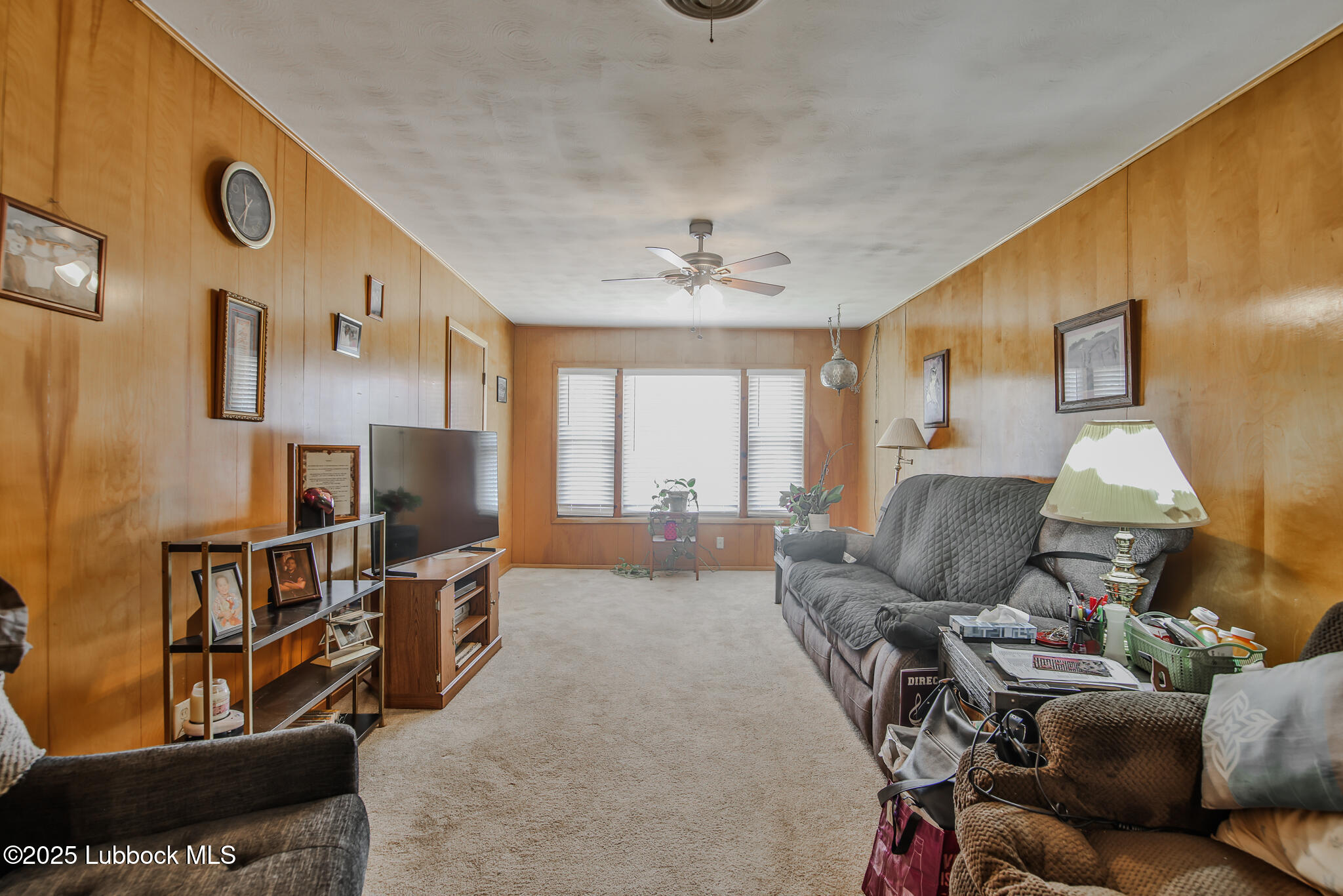 515 East 16th Street Littlefield, TX 79339 - Photo 12 of 32 a living room with furniture and a flat screen tv