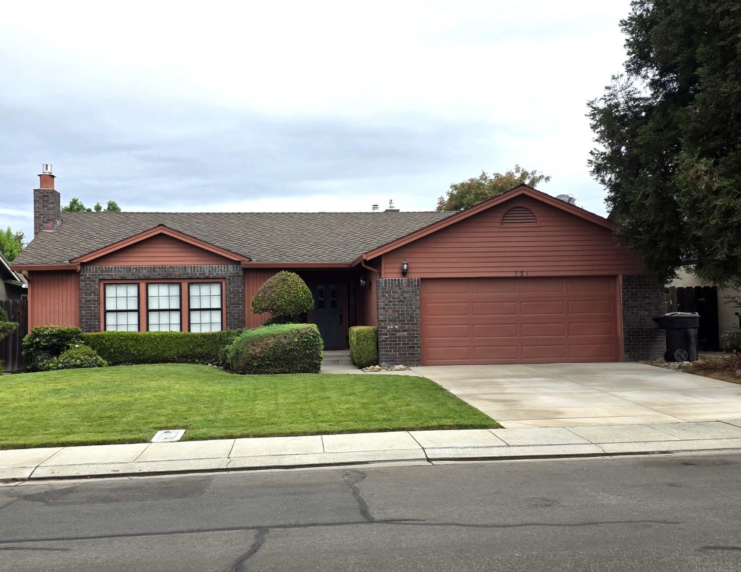 a view of a yard in front view of a house