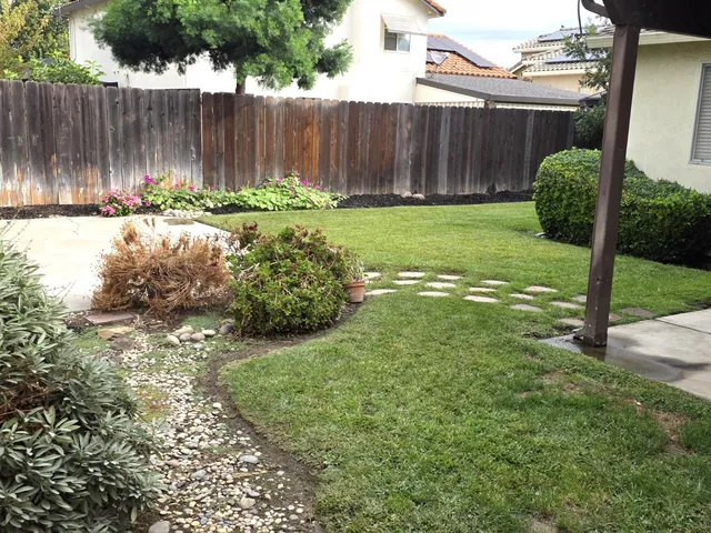 a backyard of a house with lots of green space