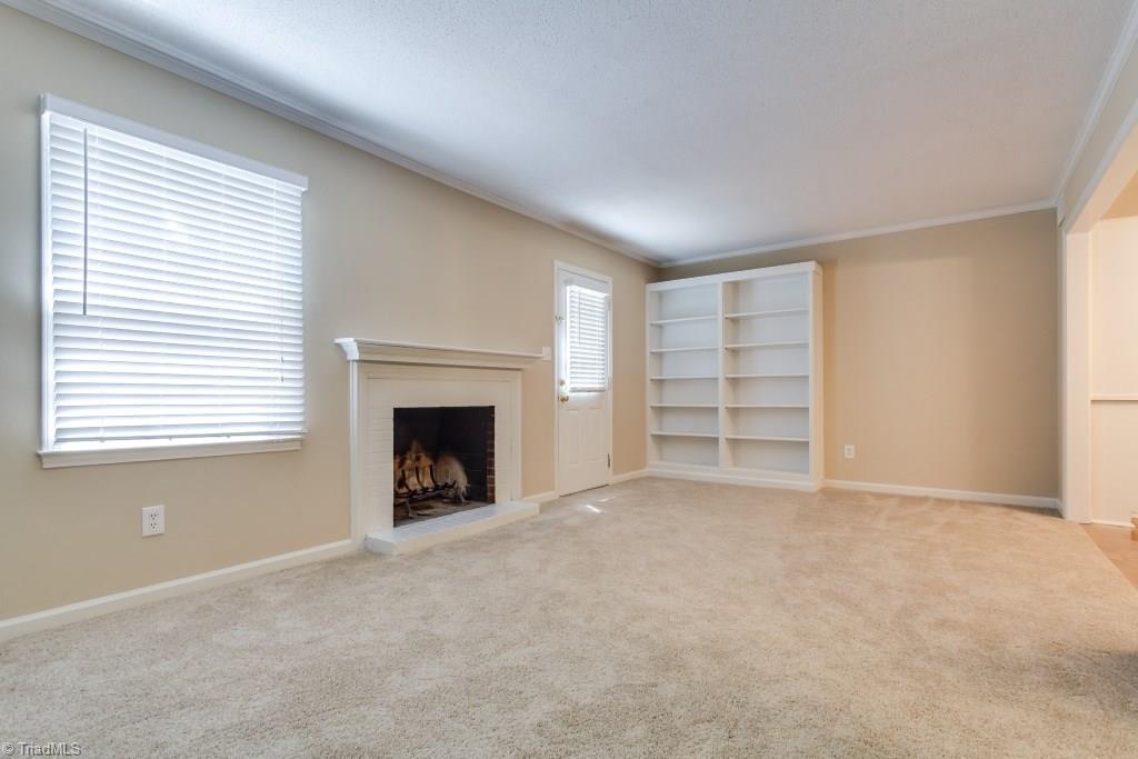 4843 Tower Road, Unit B Greensboro, NC 27410 - Photo 11 of 22 Living Room w/built-in bookshelves.