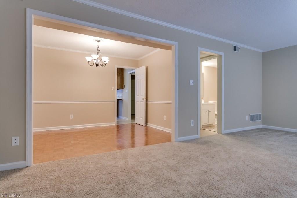 4843 Tower Road, Unit B Greensboro, NC 27410 - Photo 12 of 22 Living Room looking into Dining Room and Kitchen - great flow in this townhome.