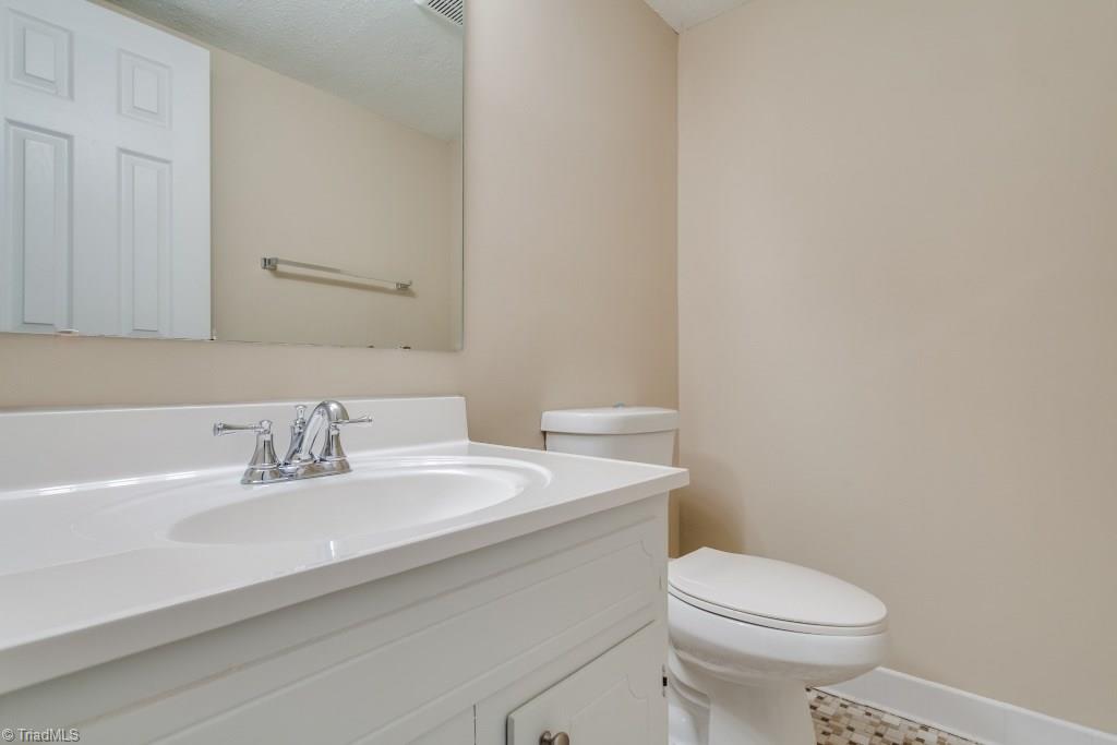 4843 Tower Road, Unit B Greensboro, NC 27410 - Photo 13 of 22 Half Bath on main level w/fresh paint and newer fixtures.