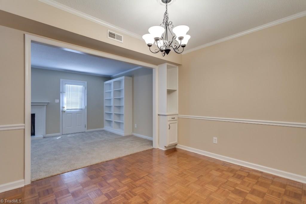 4843 Tower Road, Unit B Greensboro, NC 27410 - Photo 8 of 22 Dining Room w/parquet wood flooring looking into Living Room