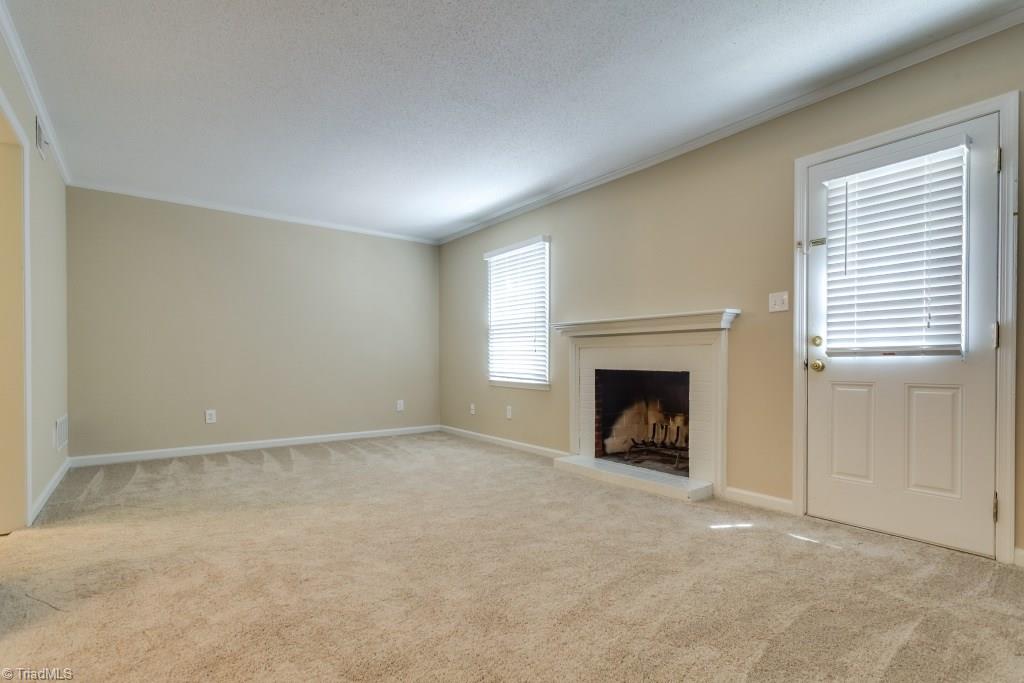 4843 Tower Road, Unit B Greensboro, NC 27410 - Photo 10 of 22 Living Room w/new carpet and paint.