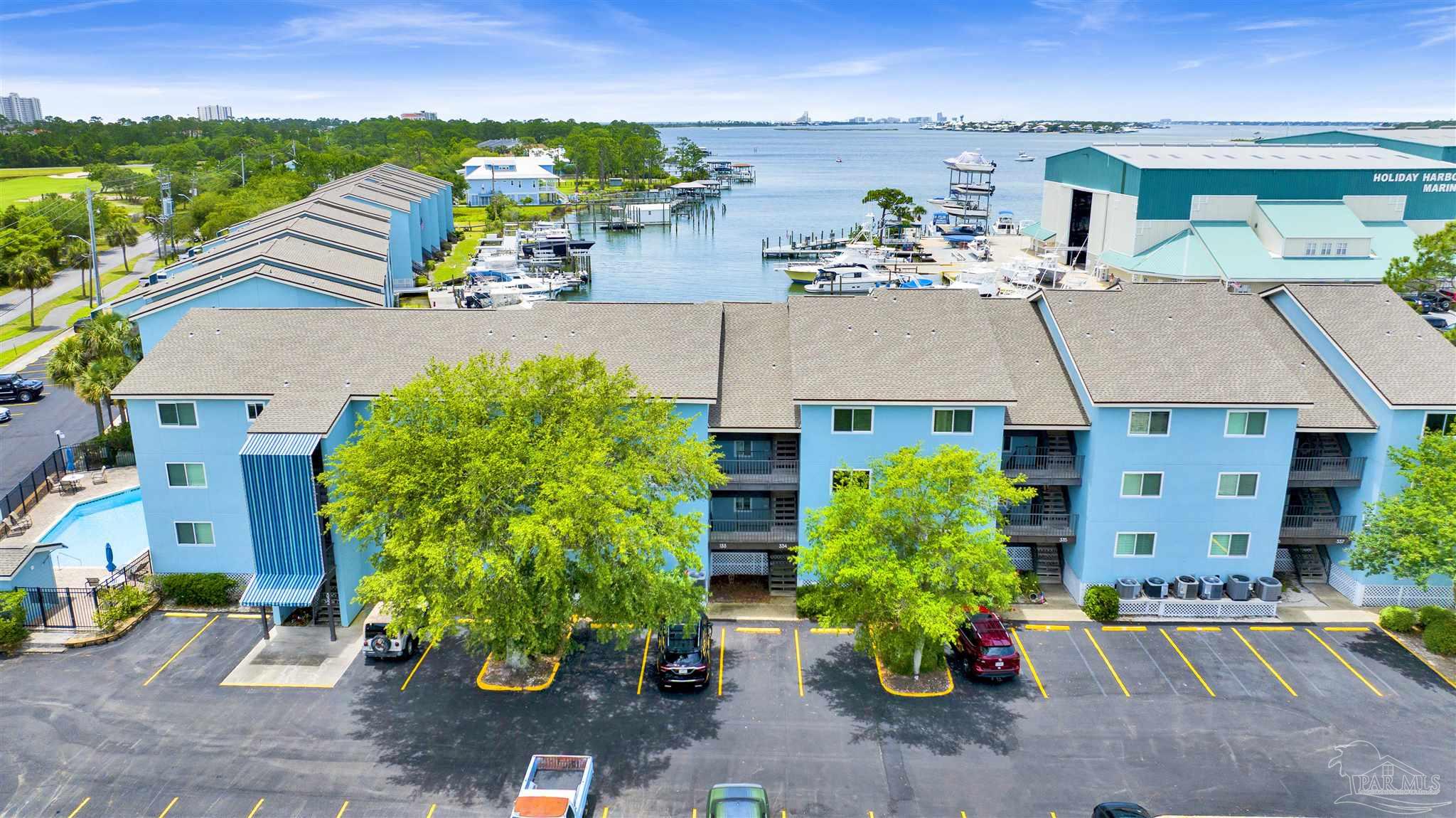 14100 River Road, Unit 334 Perdido Key, FL 32507 - Photo 27 of 35 an aerial view of a house with a yard