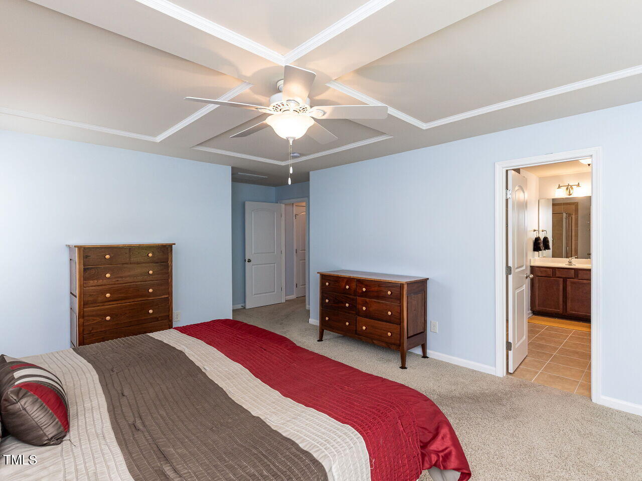 112 Victorian Oaks Drive Durham, NC 27713 - Photo 16 of 32 a bedroom with a bed and a chandelier