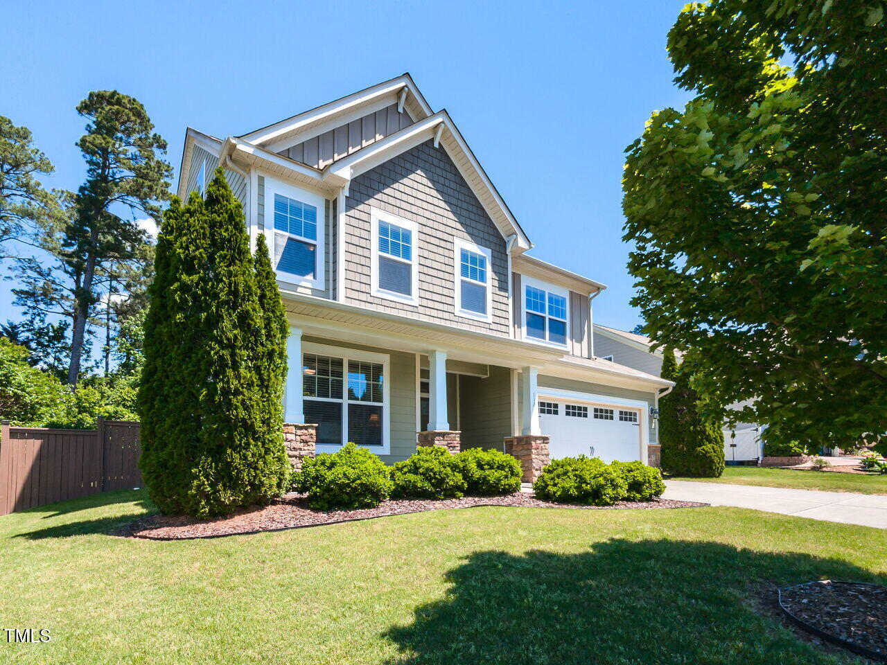 112 Victorian Oaks Drive Durham, NC 27713 - Photo 2 of 32 a front view of a house with a yard