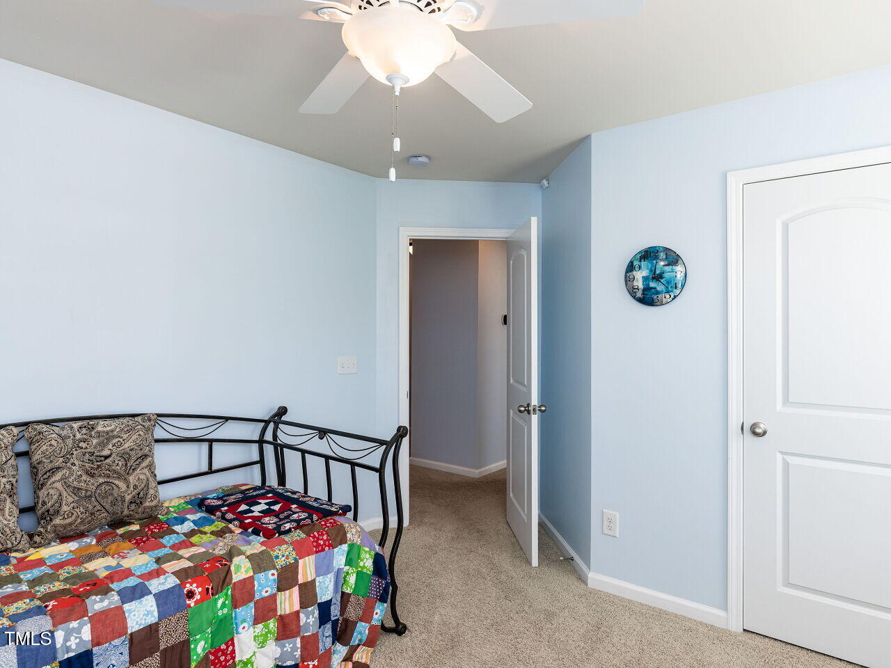112 Victorian Oaks Drive Durham, NC 27713 - Photo 24 of 32 a bedroom with bed and a chandelier