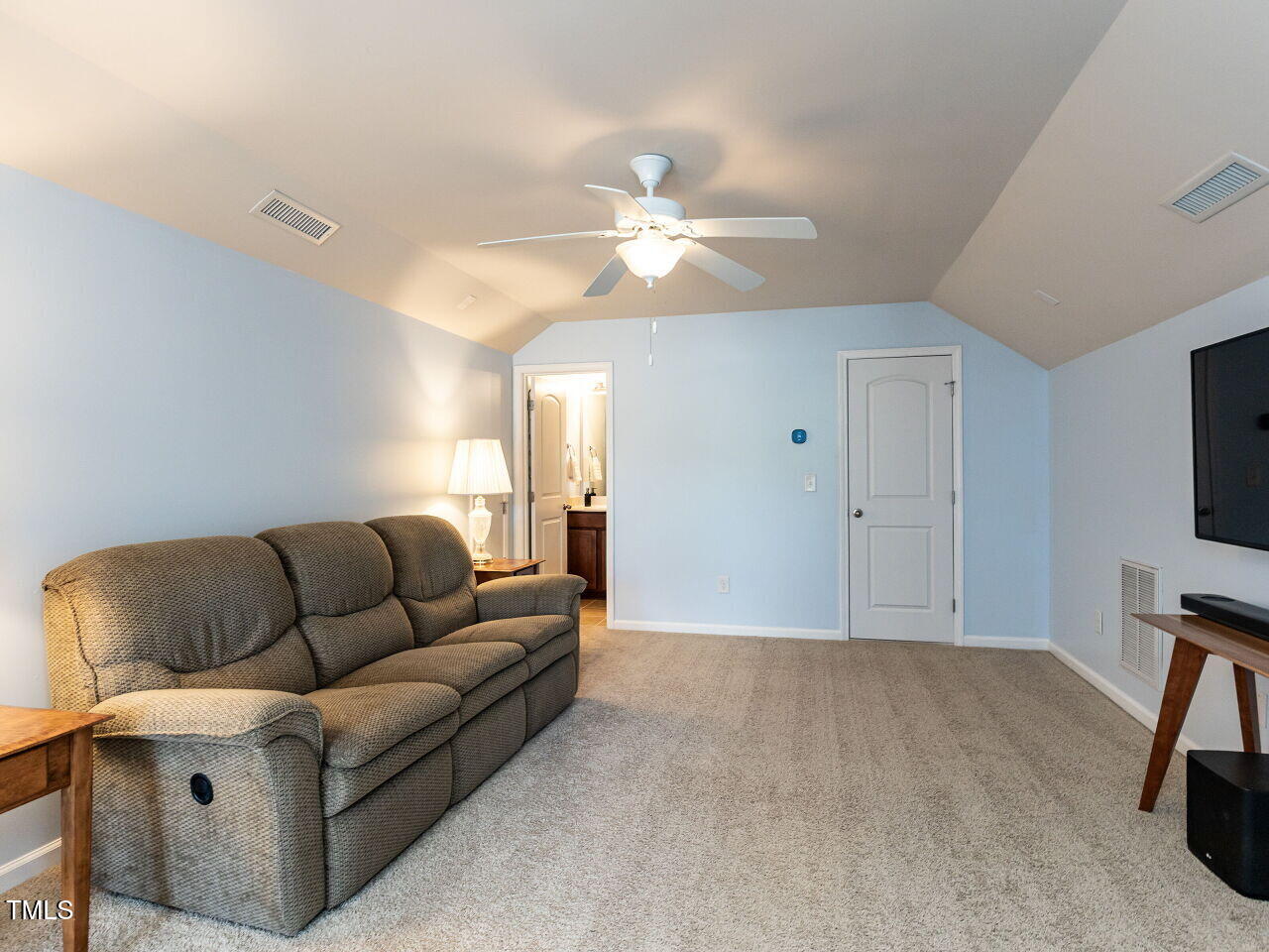 112 Victorian Oaks Drive Durham, NC 27713 - Photo 27 of 32 a living room with furniture and a flat screen tv