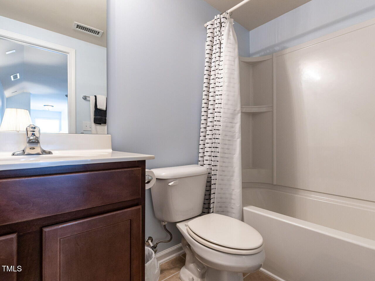 112 Victorian Oaks Drive Durham, NC 27713 - Photo 29 of 32 a bathroom with a sink a toilet a shower and a mirror