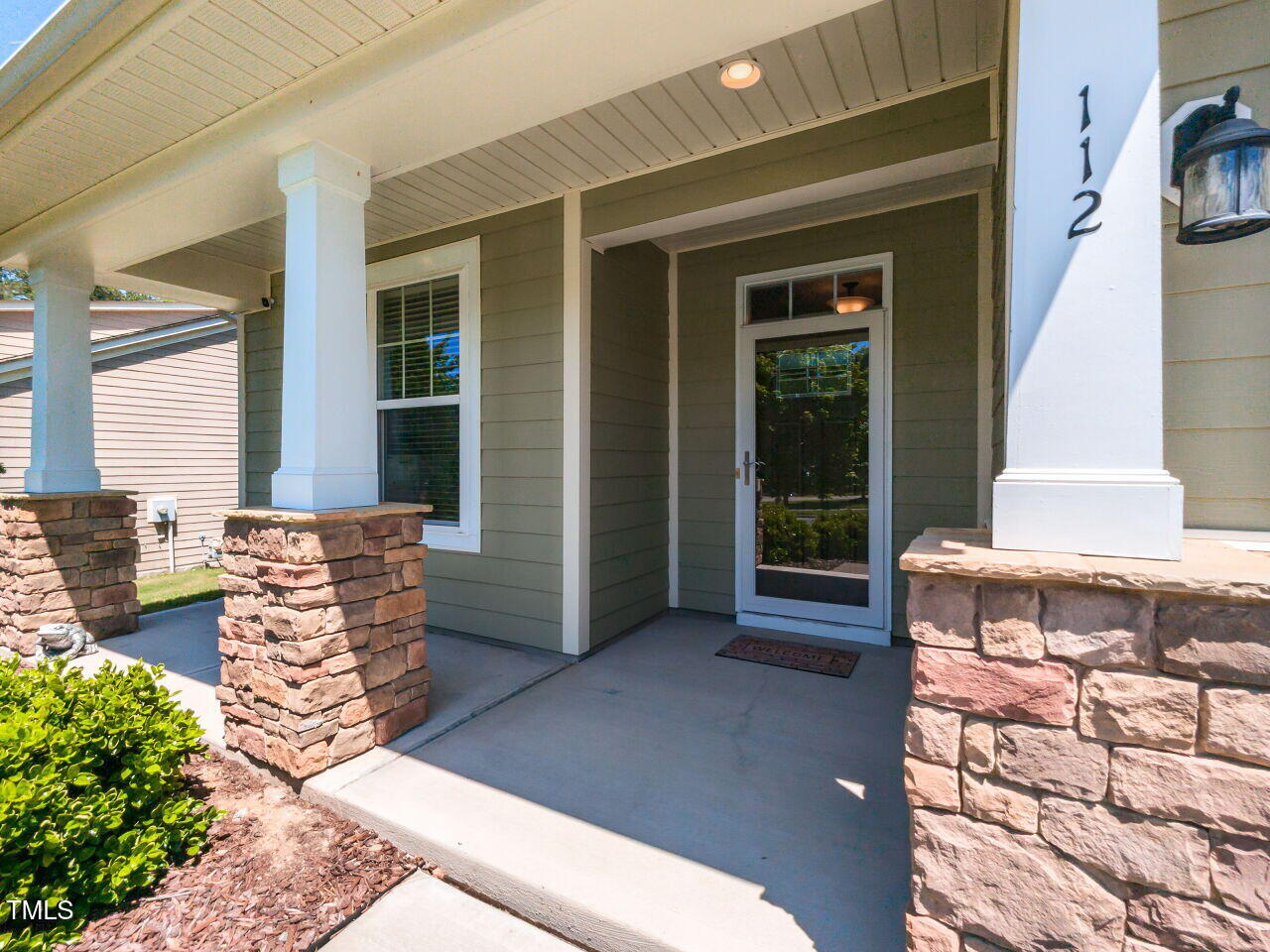 112 Victorian Oaks Drive Durham, NC 27713 - Photo 3 of 32 a front view of a house with outdoor seating