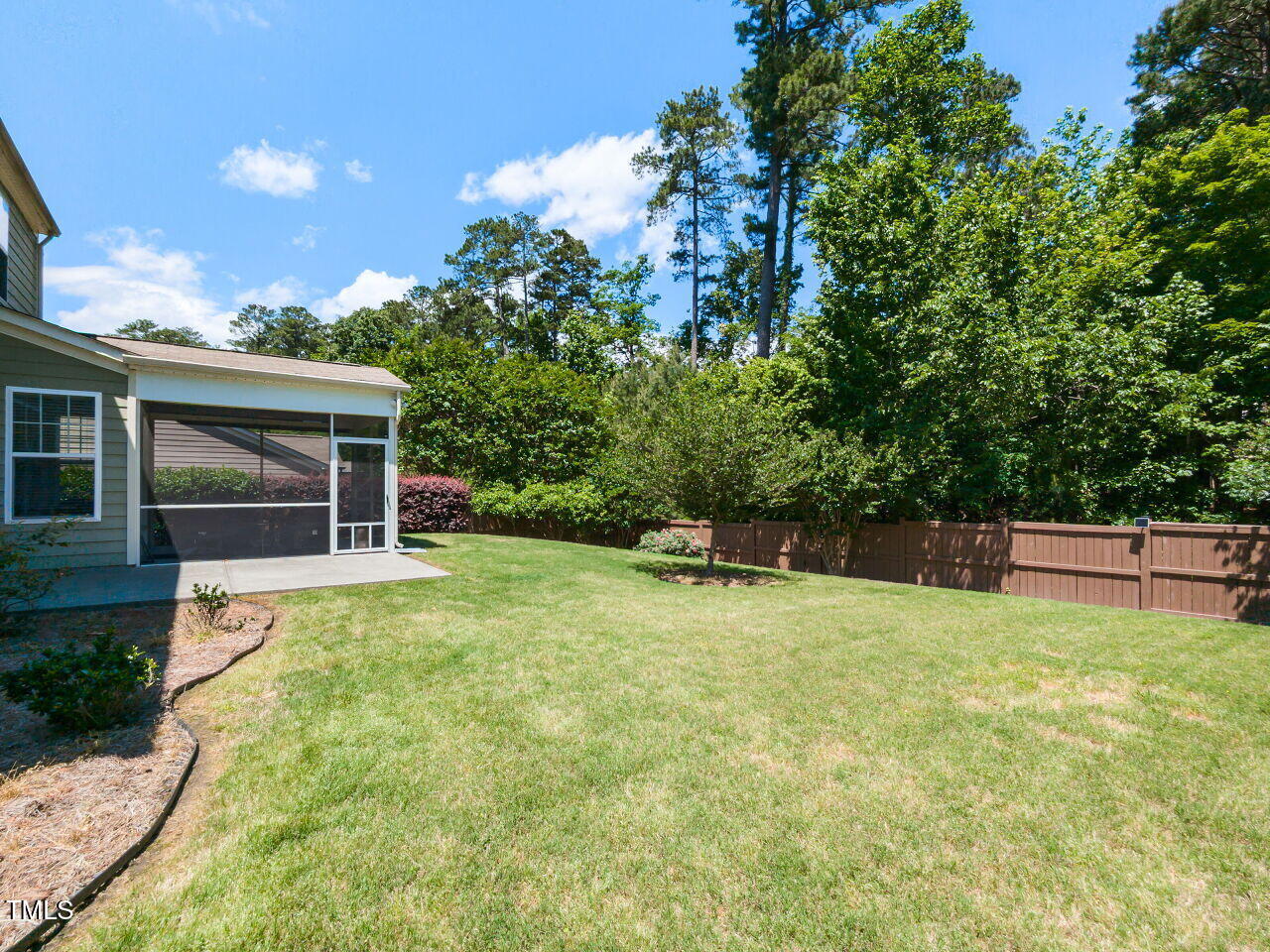 112 Victorian Oaks Drive Durham, NC 27713 - Photo 31 of 32 a backyard of a house with table and chairs