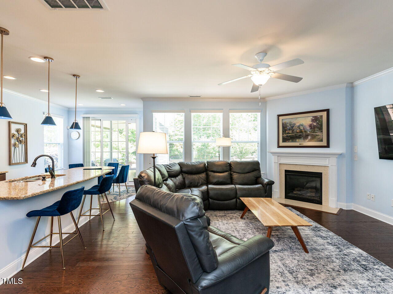 112 Victorian Oaks Drive Durham, NC 27713 - Photo 7 of 32 a living room with furniture a fireplace and a table
