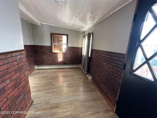 a view of gallery with wooden floor