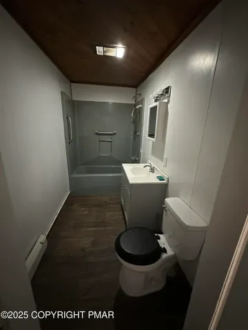 a bathroom with a toilet and a sink