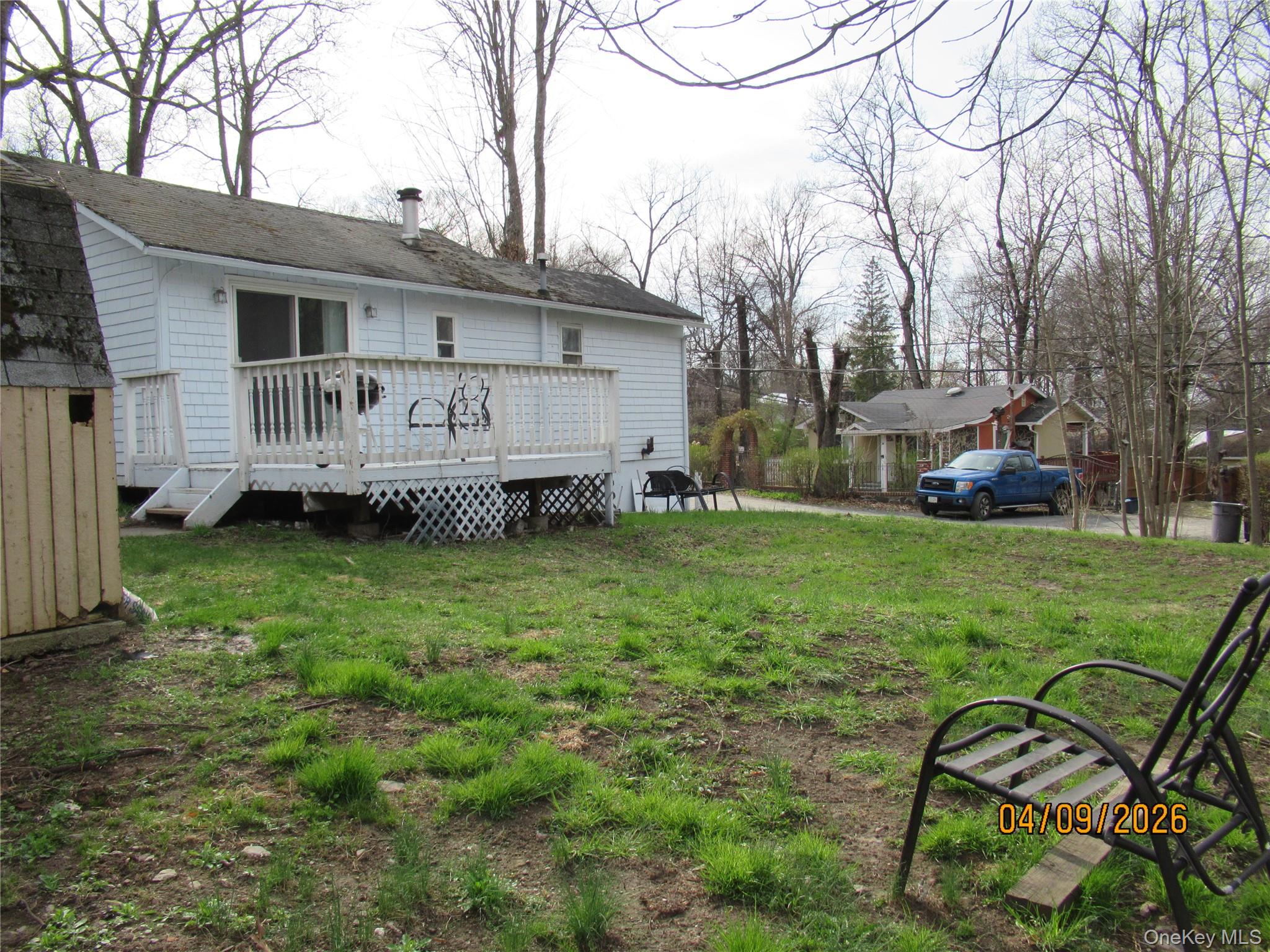 357 Mountain Lodge Road Monroe, NY 10950 - Photo 17 of 20 The property features a white exterior with a deck, complete with white railings and lattice skirting
