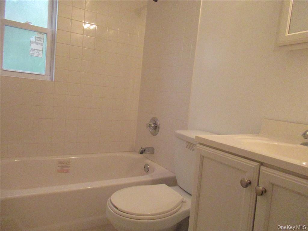 357 Mountain Lodge Road Monroe, NY 10950 - Photo 6 of 20 Full bathroom with vanity, tiled shower / bath combo, and toilet