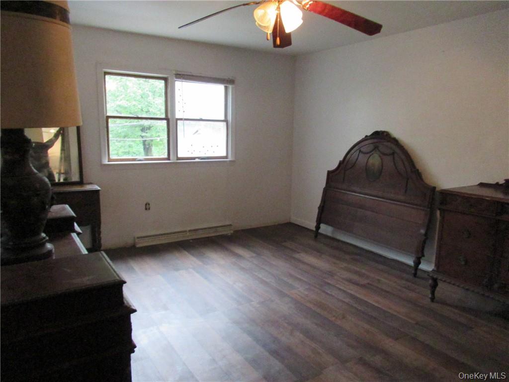 357 Mountain Lodge Road Monroe, NY 10950 - Photo 9 of 20 Bedroom with baseboard heating, hardwood / wood-style floors, and ceiling fan