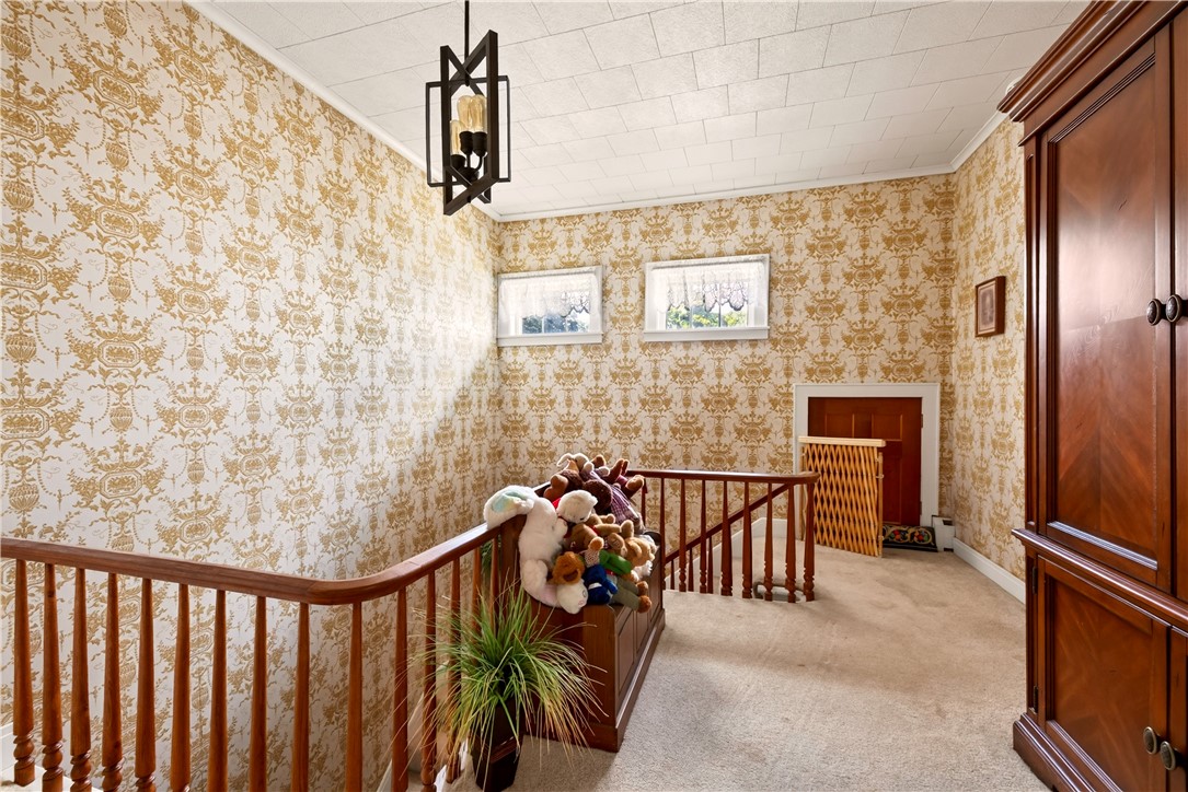 7780 Cold Springs Road Bath, NY 14810 - Photo 16 of 50 Ornate wall patterns and wooden railings frame this charming upper landing area.