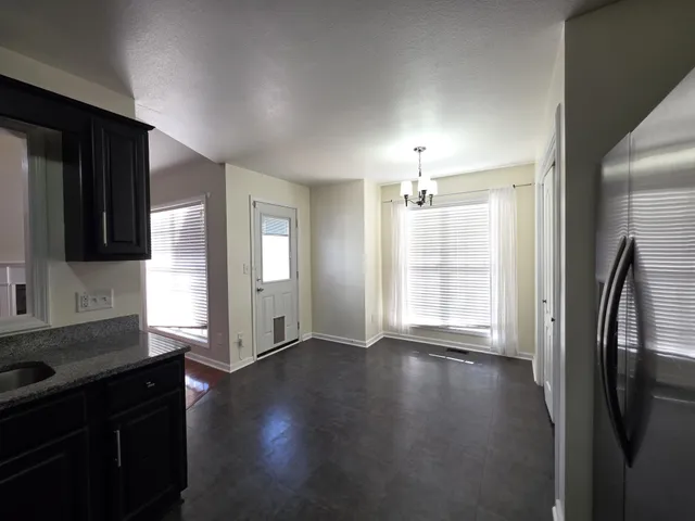 a view of a kitchen cabinets and wooden floor