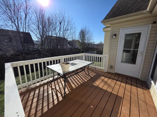 a view of a two chairs on the deck