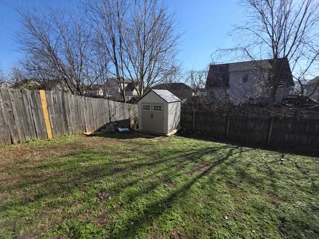 a backyard of a house with lots of green space
