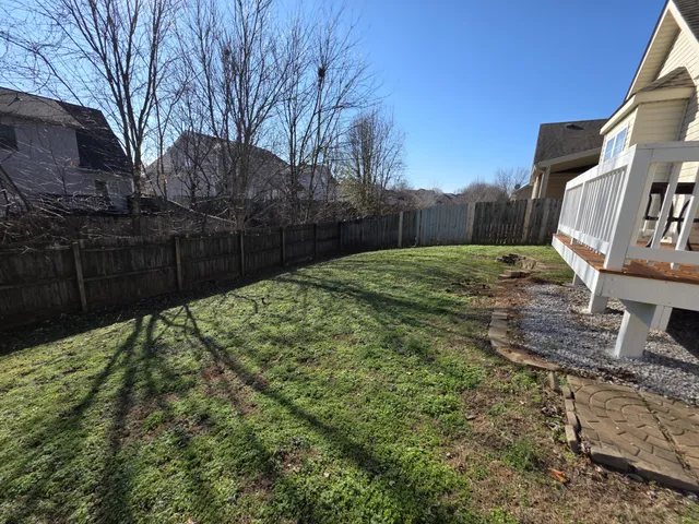 a backyard of a house with lots of green space