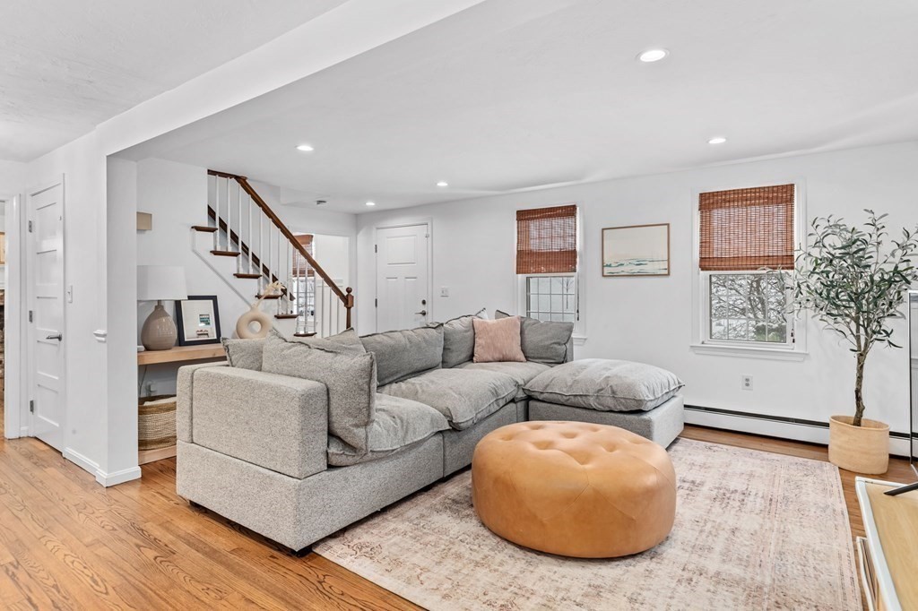 207 Tilden Road Scituate, MA 02066 - Photo 11 of 42 a living room with furniture and a wooden floor