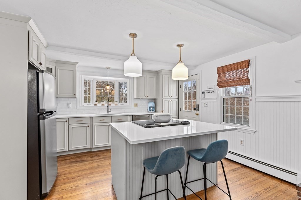 207 Tilden Road Scituate, MA 02066 - Photo 2 of 42 a kitchen with center island and stainless steel appliances
