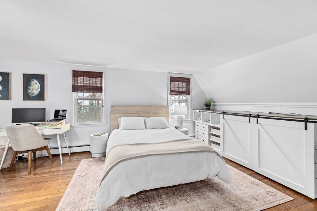 207 Tilden Road Scituate, MA 02066 - Photo 22 of 42 a room with a bed a table and chair