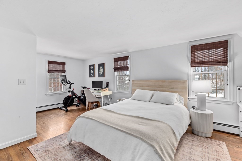 207 Tilden Road Scituate, MA 02066 - Photo 23 of 42 a bedroom with a bed a couch and a window