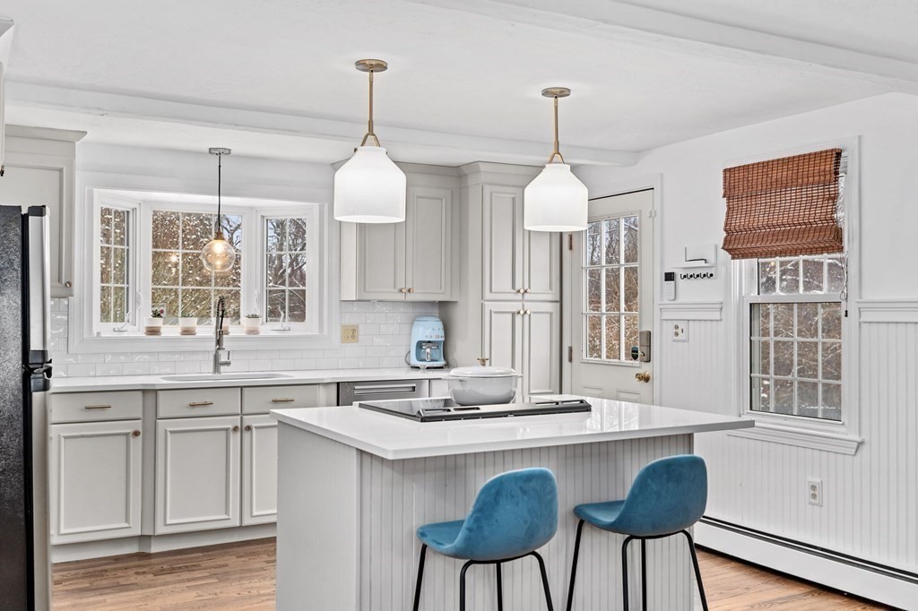 207 Tilden Road Scituate, MA 02066 - Photo 3 of 42 a kitchen with center island table and chairs