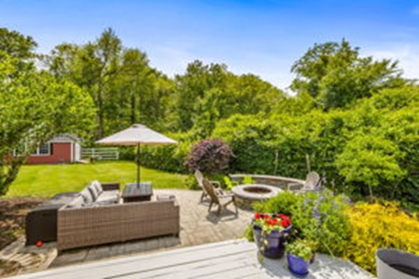 207 Tilden Road Scituate, MA 02066 - Photo 35 of 42 a view of a patio with furniture and a yard