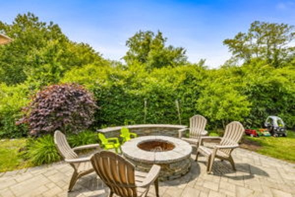 207 Tilden Road Scituate, MA 02066 - Photo 37 of 42 a patio with a table and chairs and potted plants