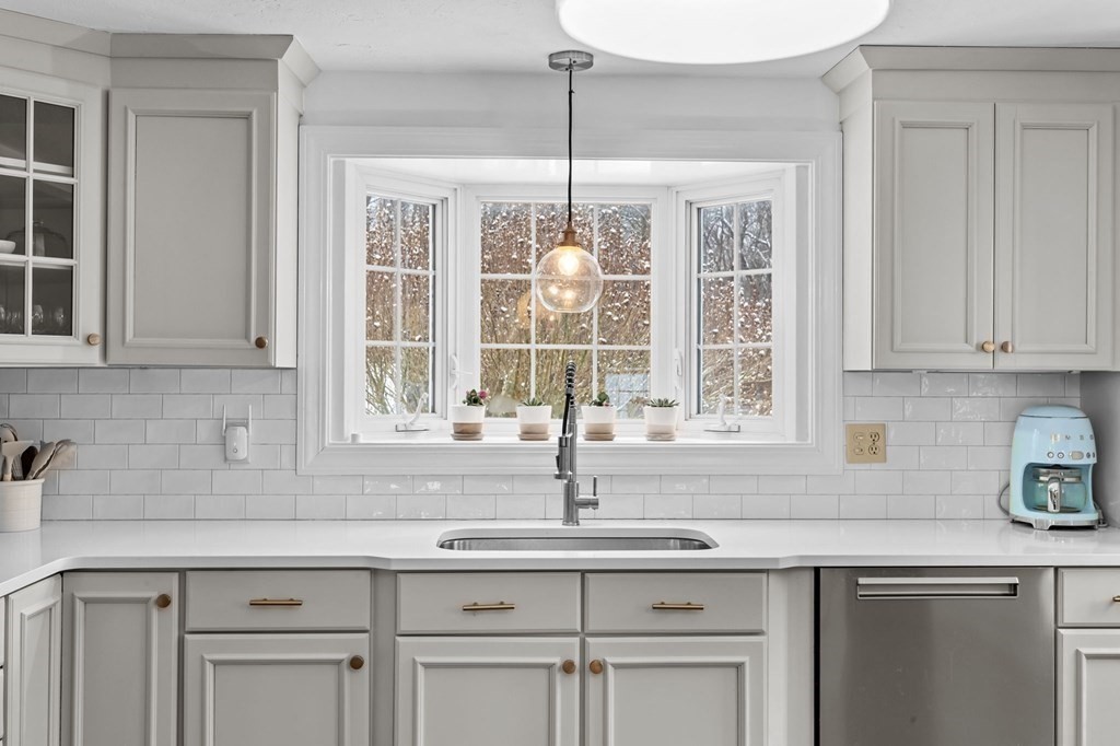 207 Tilden Road Scituate, MA 02066 - Photo 6 of 42 a kitchen with white cabinets and a window