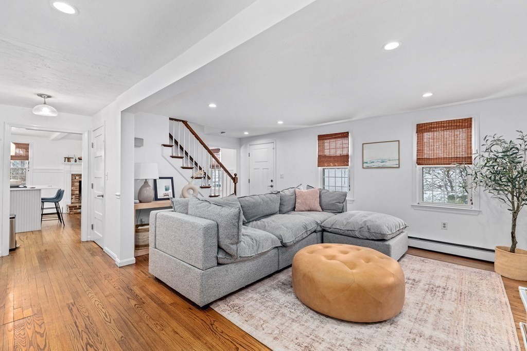 207 Tilden Road Scituate, MA 02066 - Photo 9 of 42 a living room with furniture and a wooden floor