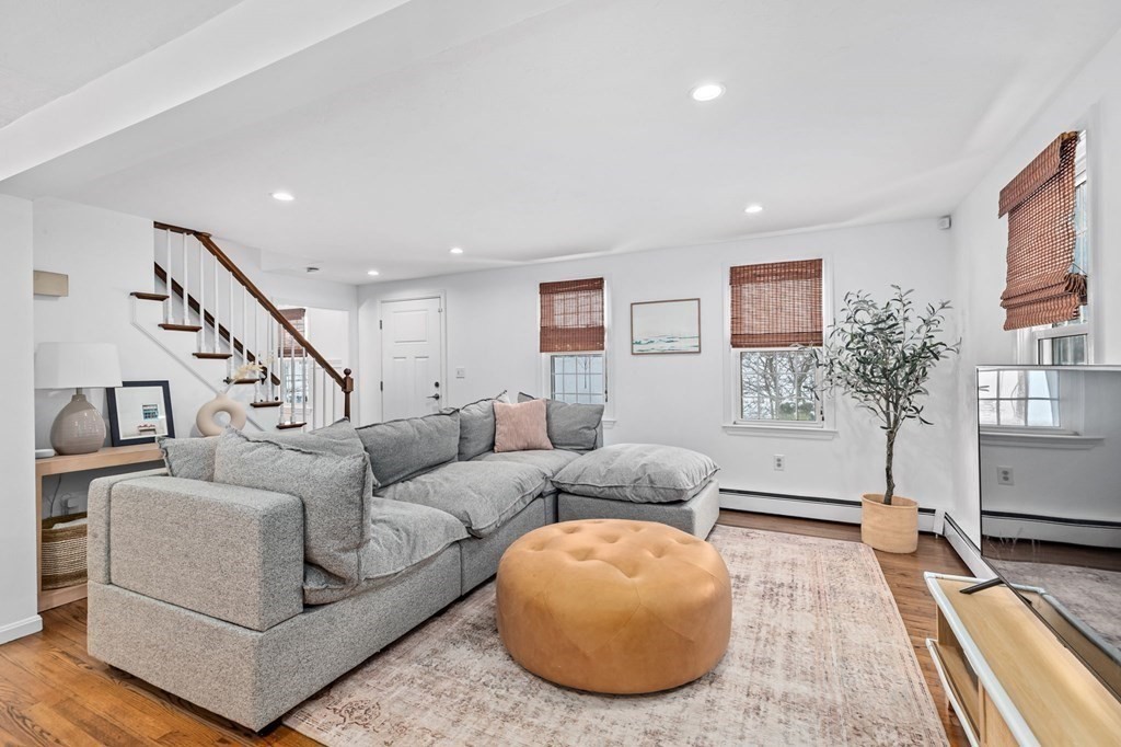 207 Tilden Road Scituate, MA 02066 - Photo 10 of 42 a living room with furniture and a rug